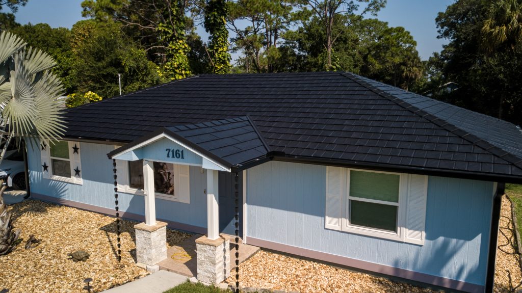 Blue Home With Roof Replacement